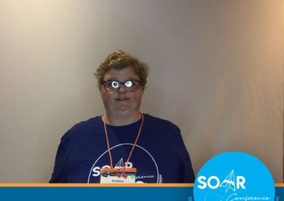 SOAR Conference participant smiles and poses for a selfie booth photo!