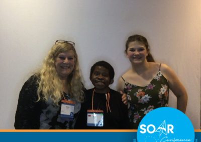 SOAR Conference participants smile and pose for a selfie booth photo!